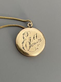 "Weight: 11.9g Dimensions: 1\" round, 18\" chain Hallmarks: Makers mark L & M Although these lockets were patented in the year 1902, this particular locket states on its backside that it is from the 'class of '12' dating it to a decade later. This is a very unique locket in that it has 3 windows and folds like an accordion. All bezels are present and the two clear windows inside the front and back covers are still present. The locket measures 1\" round and comes on an 18\" GF chain. Very lig Antique Medallion Locket Necklace Stamped 14k, Victorian Round Locket Necklace Stamped 14k, Vintage 14k Gold Locket Necklace, Vintage 14k Gold Locket Necklace Stamped 14k, Victorian Jewelry With Coin Pendant, Heirloom Yellow Gold Necklace With Hallmarks, Classic Vintage Charm Locket Necklace, Victorian 14k Stamped Round Locket Necklace, Classic Round Pendant Locket Necklace With Vintage Charm