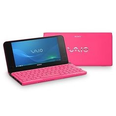 the pink sony tablet is next to an open laptop