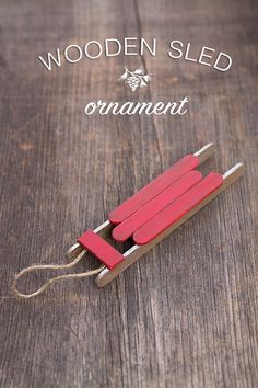 a wooden sled that is sitting on top of a table