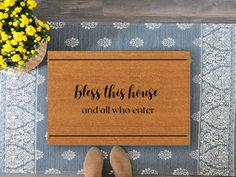 a door mat that says,'bless this house and all who enter '