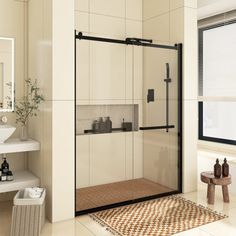 a bathroom with a sink, mirror and shower stall in the middle of the room