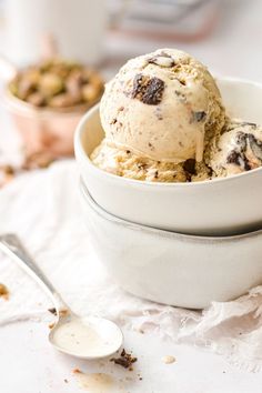 two bowls filled with ice cream on top of a table