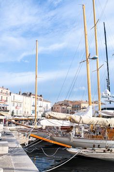 the sailboat is docked in the harbor