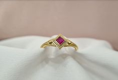 Handmade 18K solid yellow gold shiny Byzantine ring with a Ruby in the middle. It can be personalised for any ring size. With the ring you will receive an official gemological certificate! ❥ Free Express International Shipping ❥ Free Return within 5 days from the receiving day in case the jewel does not correspond to our site description. Features * Material: 18K Solid Yellow Gold * Gem Stones: 0.18ct Ruby * Ready to Ship in 1-3 Business Days ❥ Safety My jewellery are made ONLY for adult use. No Byzantine Ring, Snake Gift, Ring With Ruby, Byzantine Rings, Byzantine Jewelry, Greek Ring, Expensive Rings, Greek Design, Animal Rings