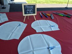 the table is set up with paper and markers