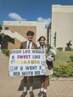 two people holding up a sign that says your life would be sweet like cinnamon if u went 2 md with me