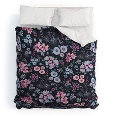 a black and pink floral comforter set with white pillow cases on the bottom half