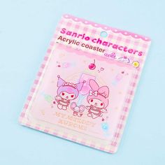 an image of a pink book with hello kitty characters on it