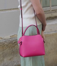 Turn heads with our Fuchsia Fleuron bag. This vibrant shade is perfect for those looking to add a bold touch to their outfit. Handcrafted in Italy, this grained calf leather bag is enhanced by a beige interior and gold details. Pink Saffiano Leather Shoulder Bag For Travel, Fleuron Bag, Pink Saffiano Leather Evening Bag, Formal Pink Saffiano Leather Shoulder Bag, Modern Pink Satchel With Handle Drop, Pink Saffiano Leather Formal Shoulder Bag, Classic Pink Saffiano Leather Bags, Pink Saffiano Leather Satchel Bag, Pink Saffiano Leather Shoulder Bag With Detachable Strap