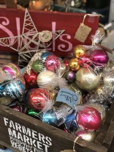 a crate filled with assorted christmas ornaments