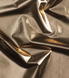 a close up view of a shiny gold cloth