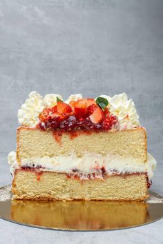 a slice of cake with strawberries on top and the words, most amazing victoria sponge cake