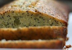 there is a loaf of bread that has been cut into slices and sits on a table