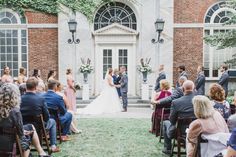 a couple getting married in front of an old building