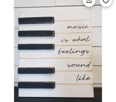 an old piano keyboard with music notes written on it and the words music is what feelings sound like