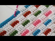 a crocheted dishcloth is being worked on