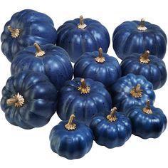 several blue pumpkins with gold decorations on them