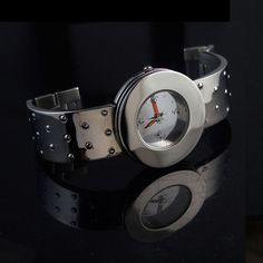 Unisex, Goth futuristic watch. Model name - PLAIN MIRROR Watch case stainless steel. Watch back stainless steel. Strap stainless steel. Length of watch case is 44mm, 1 6/8 inches. Diameter of the watch face is 35mm, 1 3/8 inches. With of strap is 22mm, 7/8 inches. Miyota quarts movement. Hi Tek graphics on the watch face. Modern Metal Analog Watch Accessories, Modern Analog Metal Watch Accessories, Silver Stainless Steel Watch Accessories With Analog Display, Modern Metal Watch Accessories For Gifts, Silver Analog Watch Accessories In Stainless Steel, Metal Watches With Stainless Steel Clasp As Gift, Modern Stainless Steel Watch Accessories For Gifts, Metal Analog Watch Accessories As Gifts, Gift Stainless Steel Watch Accessories With Metal Dial