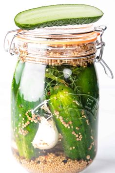 cucumber pickles and spices in a mason jar