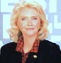 a woman with blonde hair wearing a black jacket