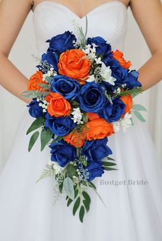 a bridal bouquet with orange and blue flowers