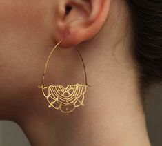 These beautiful earrings feature an intricate filigree floral design in solid brass.  The lace design has been hand drawn and cut from our Edinburgh studio.   The ear wires are made from gold plated brass, and the length of these earrings is 50mm (two inches), with the filigree hoop designed to hang a little below the earlobe.   This piece of handmade jewellery comes packaged in a nice recycled gift box with a handmade tag, all ready to give or keep. 🖤 FASTER SHIPPING 🖤 Need this fast? We offe Bridal Jewelery, Gold Statement Earrings, Gold Lace, Gold Chandelier, Handmade Tags, Gold Flowers, Jewelry Earrings Hoops, Edinburgh, Beautiful Earrings