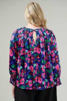 The vivi berry floral print makes a grand statement in this gorgeous blouse. It’s got a fresh fruity look with its long raglan sleeves’ and smocked fit. It has an elastic around the crew neckline and around the sleeve cuffs. Pair this blouse with your favorite pants and strappy heels for an elegant look. - Elastic crew neck details- Floral printed satin- Long balloon sleeve- Relaxed fit- Color: Cobalt MultiSize + Fit - Model is 5'9" and wearing size 2X- Measurements taken from size 2X - Chest: 2 Multicolor Blouson Sleeve Blouse For Brunch, Multicolor Blouson Sleeves Blouse For Brunch, Multicolor Tops With Smocked Back For Brunch, Multicolor Long Sleeve Smocked Blouse, Multicolor Long Sleeve Smock Blouse, Multicolor Smock Blouse With Long Sleeves, Multicolor Long Sleeve Blouse With Smocked Back, Multicolor Smock Blouse For Fall, Multicolor Fall Blouse With Smocked Back