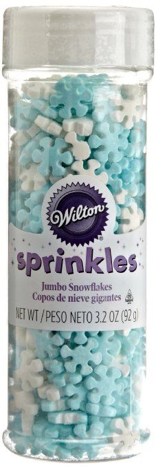 sprinkles in a glass jar with white and blue speckles on it