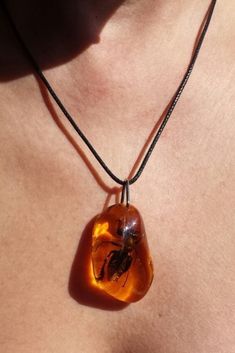 Bee necklace Lovely fine jewelry real bee in resin necklace unique handmade jewelry large pendant amber color epoxy resin Bee pendant black faux leather cord Real Bee pendant necklace in Honey Amber Resin necklace Amulet Nature necklace jewelry for adults loves insects gift girl child. America size 1/60 inch by 1 inch cord 17.72 inches + 2 chain pendant size 4 cm by 2.5 cm cord 45 cm + extension chain Resin Necklace