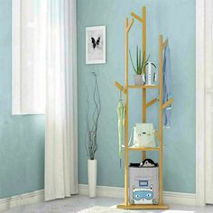 a room with blue walls and white carpeted flooring has a yellow shelving unit in the corner