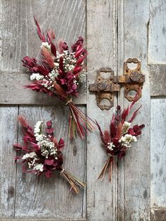 two bouquets of flowers are placed on the door