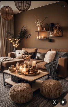 a living room filled with lots of furniture and candles on top of it's coffee table