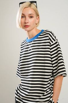 A striped knit top with round neckline and short sleeveDetails:Self : 95% Cotton 5% SpandexContrast : 65% Cotton 30% Polyester 5% SpandexSize & Fit- Model is 5`8" And Wearing Size Small- Measurements Taken From Size Small- Approx. Length: 26.5" Black Vertical Stripes Top For Spring, Black Vertical Striped Top For Spring, Black Top With Contrast Stripes For Spring, Spring Black Top With Contrast Stripes, Trendy Striped Short Sleeve T-shirt, Black Horizontal Stripe Short Sleeve T-shirt, Trendy Black Tops With Contrast Stripes, Trendy Crew Neck T-shirt With Vertical Stripes, Trendy T-shirt With Vertical Stripes And Crew Neck