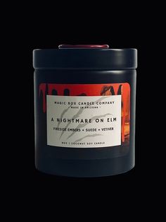 a candle that is sitting on top of a black surface with the words nightmares on it