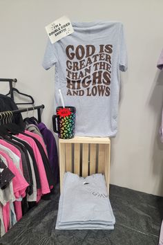 a t - shirt and other items are on display