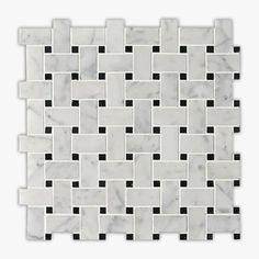 a white marble tile with black squares on it