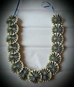 a necklace made out of dollar bills