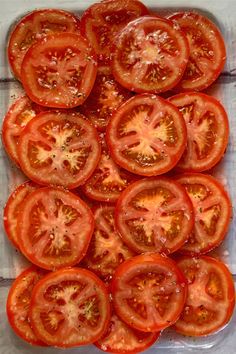 sliced tomatoes in a baking dish ready to be cooked