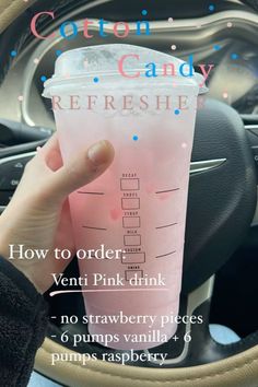 a person holding a pink drink in their hand with instructions on how to order it