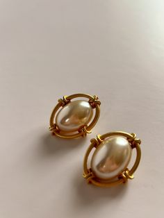 Unsigned vintage baroque clip on earrings gold and faux pearl. The pearl is not perfectly centered on one of the earrings. Please see photos.  In great vintage condition. Vintage Pearl Clip-on Earrings For Gift, Vintage Pearl Clip-on Earrings As Gift, Vintage Pearl Clip-on Earrings, Vintage Pearl Drop Clip-on Earrings, Vintage Gold Pearl Earrings For Formal Occasions, Vintage Formal Clip-on Earrings With Pearl Drop, Vintage Gold Clip-on Pearl Earrings, Vintage Formal Clip-on Pearl Drop Earrings, Vintage Gold Pearl Clip-on Earrings