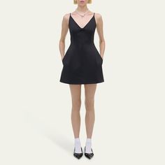 Marc Jacobs structured satin dress adorned with a tonal center-front bow  V neckline Fixed spaghetti straps Side seam pockets Hem falls above the knee A-line silhouette Invisible back zipper  Polyester Lining: Polyester Dry clean Imported