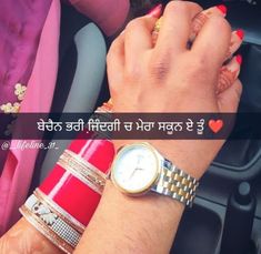 a woman's wrist with two different bracelets and a watch on her wrist