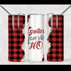 two red and black plaid cans with santa's favorite 50 on them