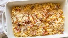 macaroni and cheese with bacon in a white casserole dish