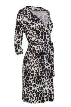 Show off your inner fierceness with Diane von Furstenberg hugging your curves! The bold and wild leopard print is complimented with DVF’s classic staple, the wrap dress. Perfect for a professional look paired with a work tote or as a dinner date look with classic black pumps! Size 4 100% silk Unlined Wrap closure Crop sleeves Bust 32" Waist 36" Shoulder to hem 40" Sleeve length 18.5" Leopard Print Wrap Dress, Wild Leopard, French Girl Chic, Black Leopard Print, Work Tote, Buy Shoes Online, Printed Wrap Dresses, Dinner Date, Black Leopard