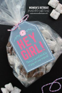 there is a bag of chocolates with a tag on it that says hey girl