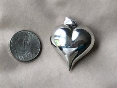 "Best, most elegant puffy heart design ever. The top shaped like perfect glutes, and the bottom swoops down to a pointed finish.  Size:  almost 1-1/4\" plus bail.  6.8 grams sterling silver. Hallmarks:  925 Condition: good, see pics. No dents Vintage / antique, still in good displayable / usable condition. See pics, click on 'zoom' for large views as they are an integral part of the description  :). To see more of our antique and vintage jewelry, please visit:  http://www.etsy.com/shop/AntiqueAd Noreena Jasper, Hessonite Garnet, Necklace Heart, Wire Weaving, Puffy Heart, Collar Jewelry, Heart Design, Copper Wire, Heart Necklace