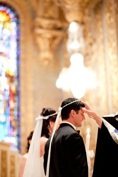 the bride and groom are getting ready to walk down the aisle