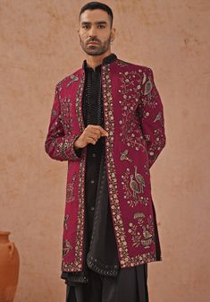 Elevate your style with Wine embroidered sherwani. Crafted from georgette, the sherwani showcases intricate cut dana, Swarovski, and pearl handwork. The handwork collar detailing adds an extra touch of elegance. Paired with a black kurta featuring embroidered yoke design, front hook closure, two pockets, and pure lining. Completed with patiyala pants and dupatta. Perfect for special occasions like Sangeet, Mehendi, or as a wedding guest outfit. Composition : Sherwani, Kurta, Patiyala Pant & Dupatta : Viscose Georgette Care: Dry Clean Only and Vacuum Storage This product can be customized for sleeves, length and colour Delivery : 4-6 weeks as the product is hand crafted. Check Size Guide or choose MySize for free customisation (All Sizes above XL can be made at 15% additional cost) For more Embroidered Long Bandhgala For Reception, Elegant Embroidered Sherwani For Designer Wear, Elegant Designer Embroidered Sherwani, Elegant Embroidered Designer Sherwani, Unstitched Bandhgala With Intricate Embroidery, Elegant Embroidered Outerwear For Diwali, Traditional Festive Outerwear For Reception, Formal Straight Kurta Bandhgala With Intricate Embroidery, Traditional Drape Outerwear With Dabka Work For Eid