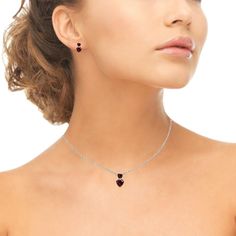 This classic jewelry set features a double heart pendant necklace and matching stud earrings, wear this stylish jewelry set to enhance your daytime and evening attire. The necklace showcases two heart-shaped Created Ruby gemstones, for a gorgeous two-stone friendship & romantic style set. The pendant measures 12mm in length and dangles from a 18-inch rolo chain that secures by a spring-ring clasp. The stud earrings feature a pair of two heart-shaped Created Ruby gemstones and measure 10mm in Turquoise Heart Necklace, Bezel Set Necklace, Dainty Pendant Necklace, Letter Pendant Necklace, Friendship Necklaces, Leverback Earrings, Trendy Necklaces, Silver 925 Necklace, Rolo Chain